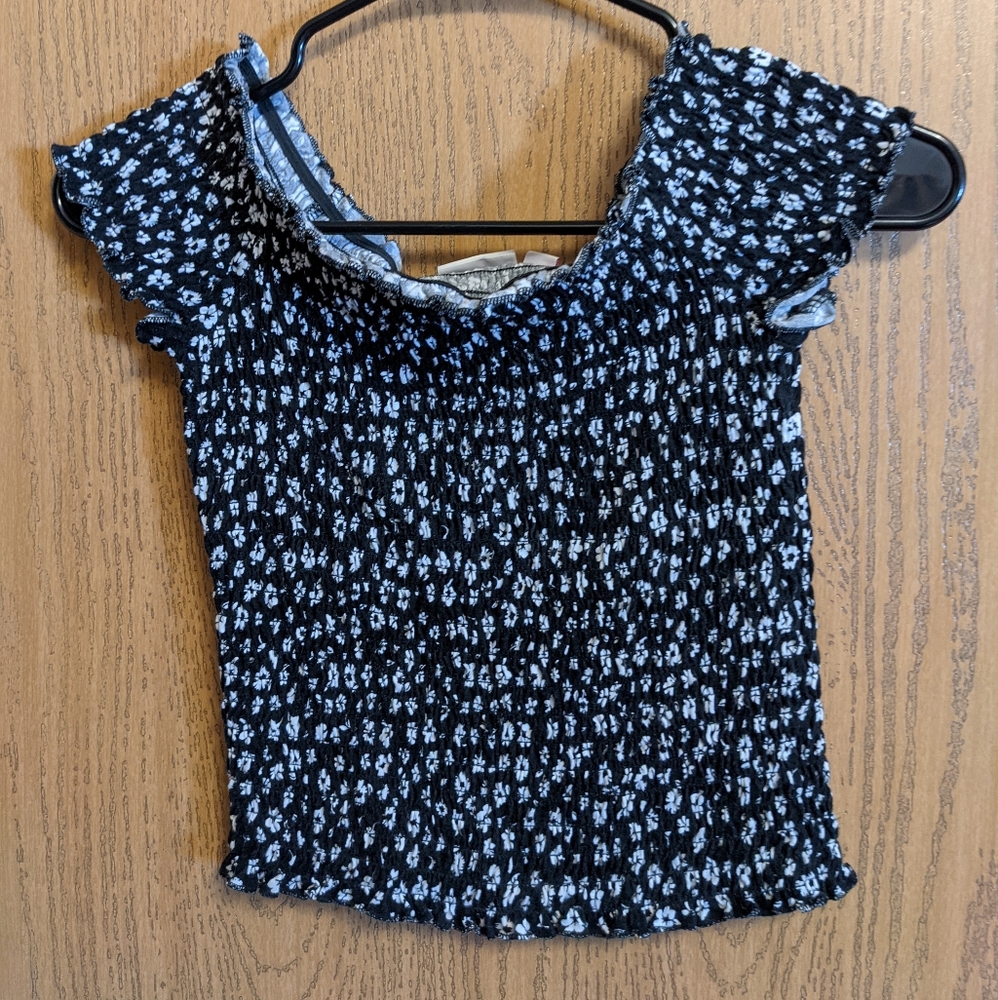 Black with white flower off the shoulder top